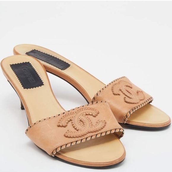 CHANEL Shoes - CHANEL Tan Leather CC Sandals Heels Slides